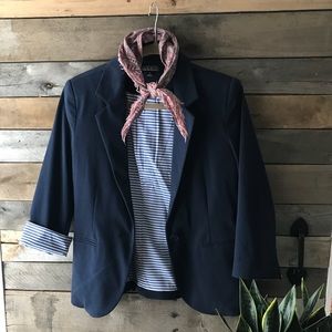 Navy blazer with striped lining.